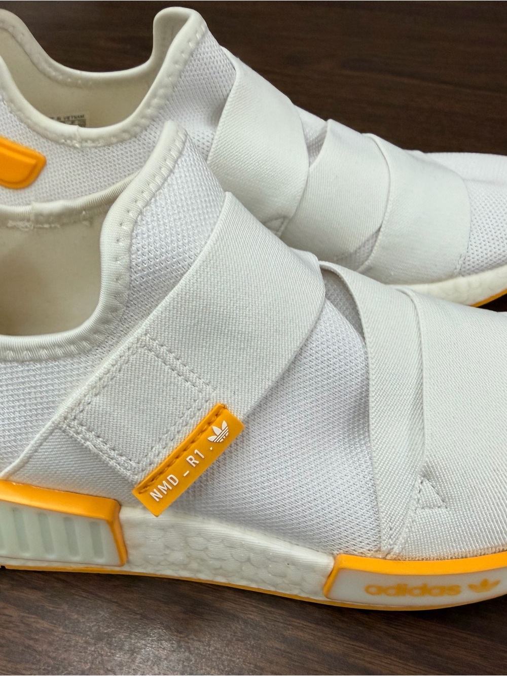 adidas White Slip-On NMD_R1 Sneakers with Orange Accents